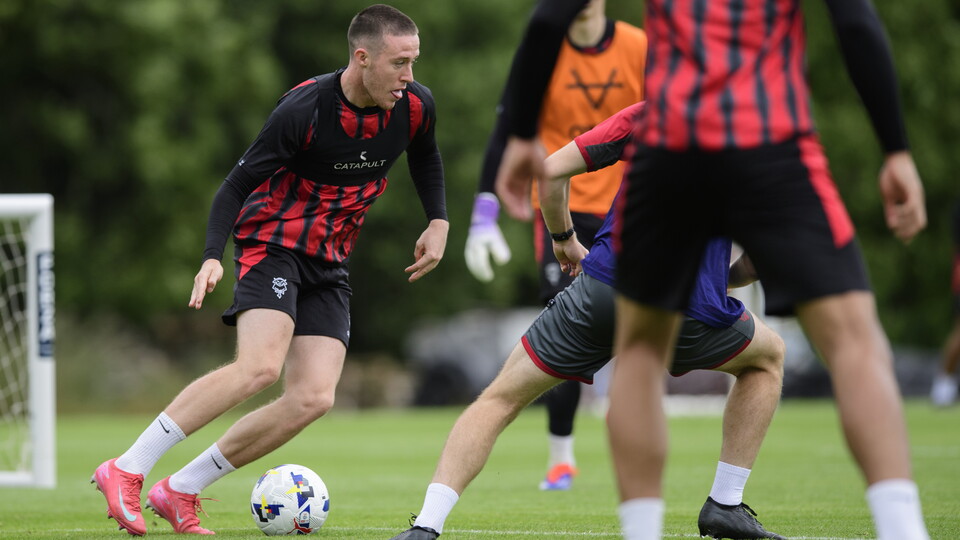 Jack Moylan dribbles the ball during training. 