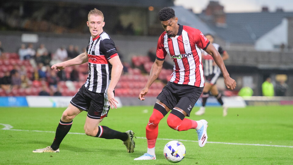 Reeco Hackett of Lincoln City under pressure from Harvey Rodgers of Grimsby Town during the pre-season friendly match between Grimsby Town and Lincoln City at Blundell Park, Cleethorpes.