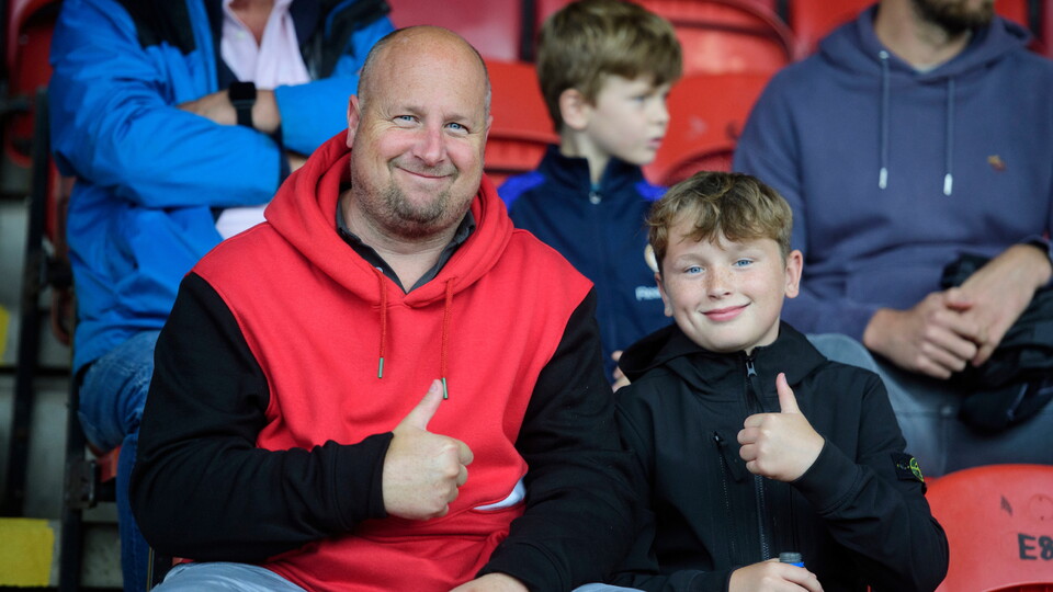 Lincoln City fans enjoy the pre-match atmosphere the pre-season friendly match between Grimsby Town and Lincoln City at Blundell Park, Cleethorpes.