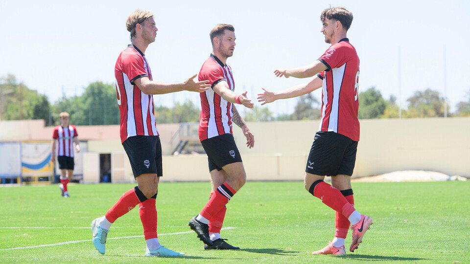 The Imps celebrate scoring during the pre-season game against Bromley