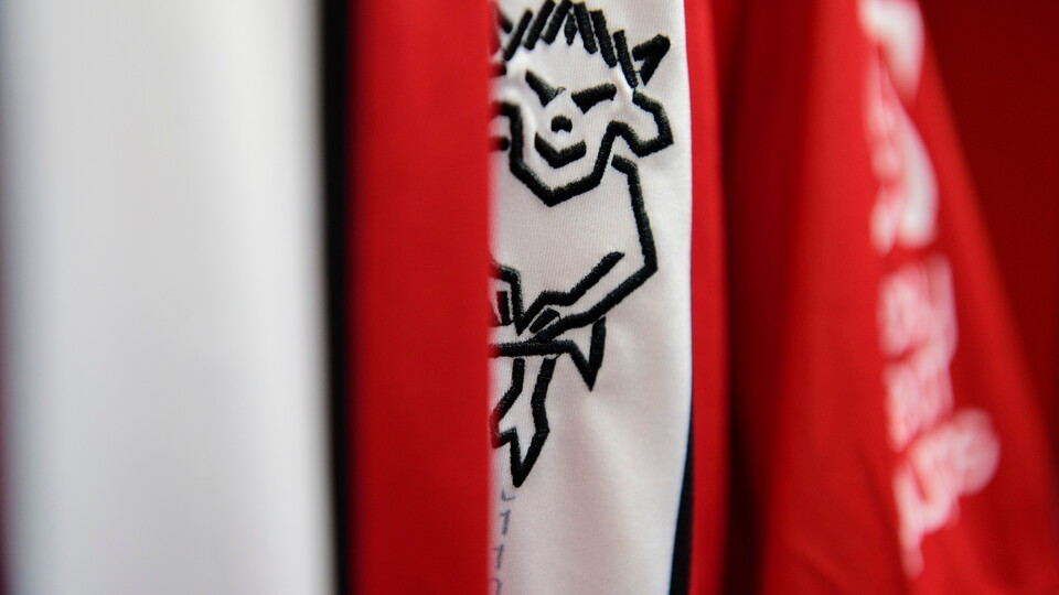 The Lincoln City club badge on a home shirt in the changing room prior to the pre-season friendly match between Lincoln City and West Bromwich Albion at LNER Stadium, Lincoln.
