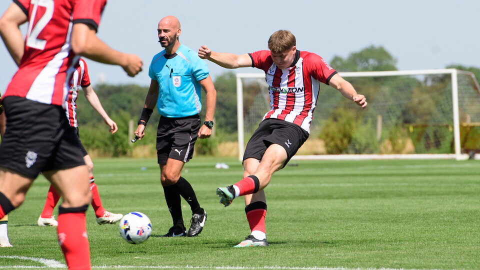 Freddie Draper of Lincoln City scores his side's second goal during the pre-season friendly match between Lincoln City and Huddersfield Town at Elite Performance Centre, Scampton.