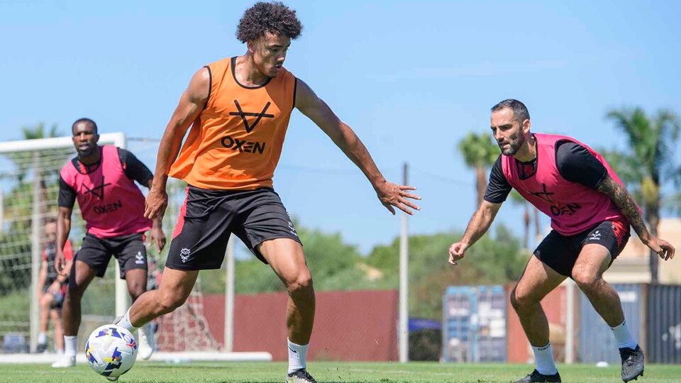 Jovon Makama of Lincoln City, centre, and Adam Jackson of Lincoln City during a pre-season training camp sessions at Browns Sports Resort, Vilamoura, Portugal.