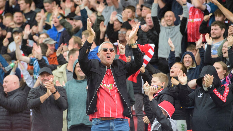 Lincoln City fans celebrate their teams goal during the EFL Sky Bet League One match between Lincoln City and Barnsley at LNER Stadium, Lincoln.