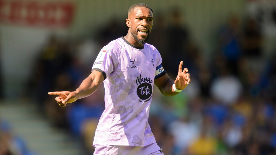 Tendayi Darikwa in action for Lincoln City at AFC Wimbledon