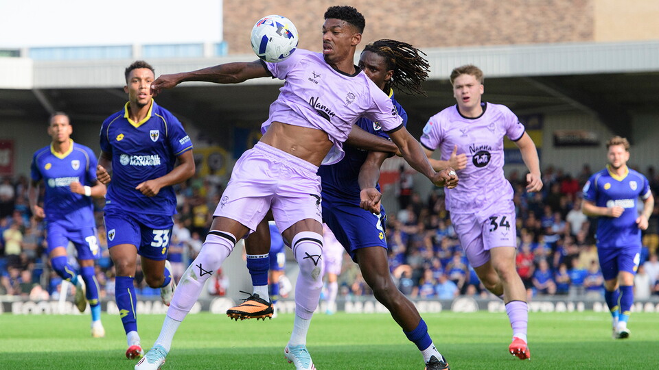 Reeco Hackett battles during City's game at AFC Wimbledon
