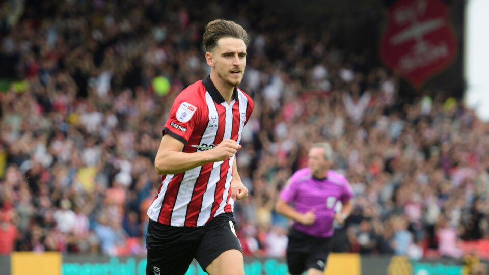 Tom Bayliss of Lincoln City celebrates scoring the opening goal during the EFL Sky Bet League One match between Lincoln City and Plymouth Argyle at LNER Stadium, Lincoln.