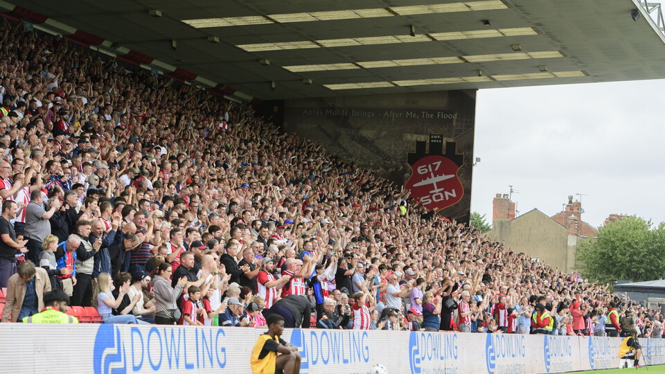 Lincoln City fans celebrate a goal