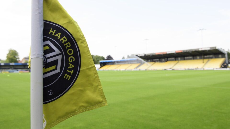 A Harrogate flag in front of the pitch at the Exercise Stadium
