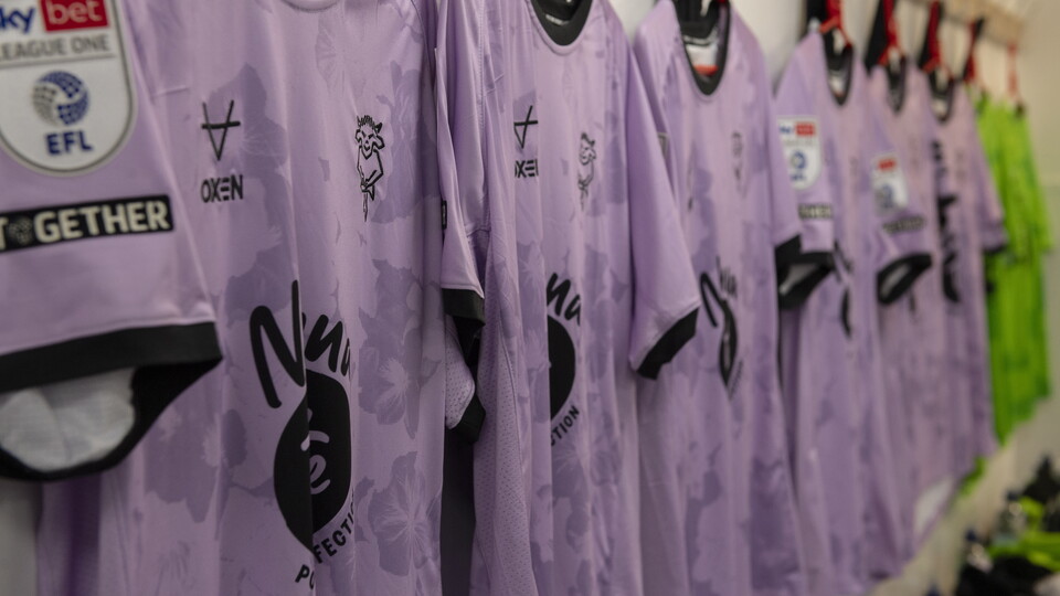 A close up of violet Lincoln City shirts.