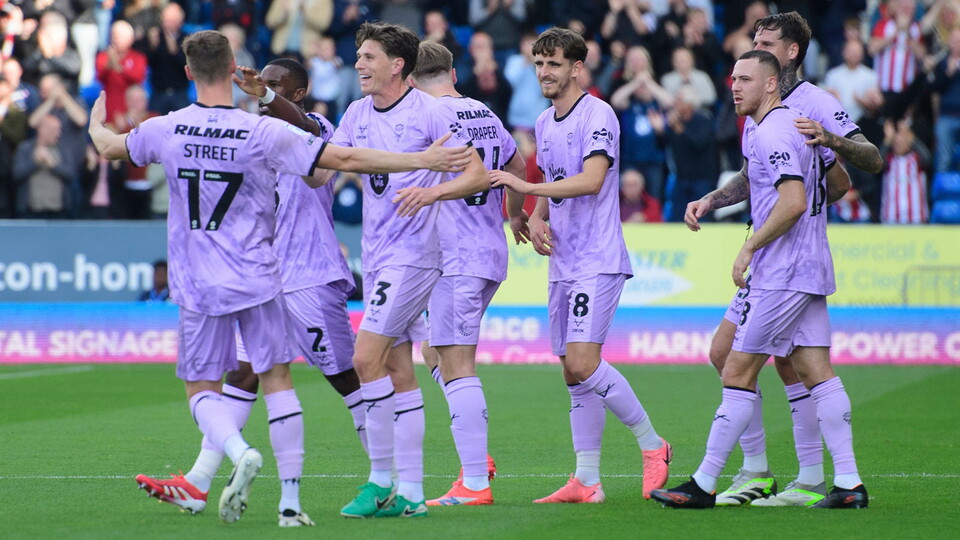 City celebrate scoring at Peterborough United