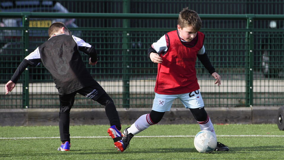 children playing football