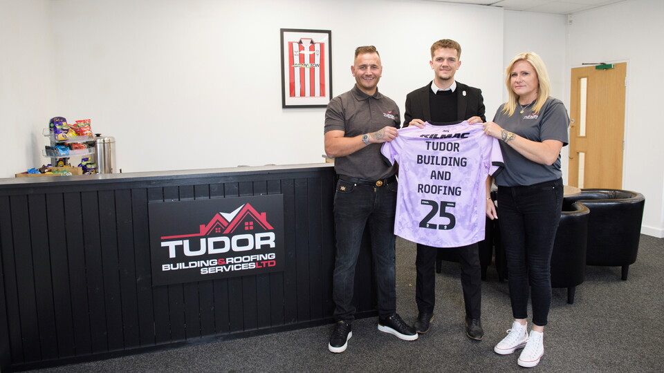 Lincoln City commercial partnership | Bobby Copping, head of commercial of Lincoln City with Tudor Building and Roofing Services, the new sponsors of the players lounge at Lincoln City’s LNER Stadium