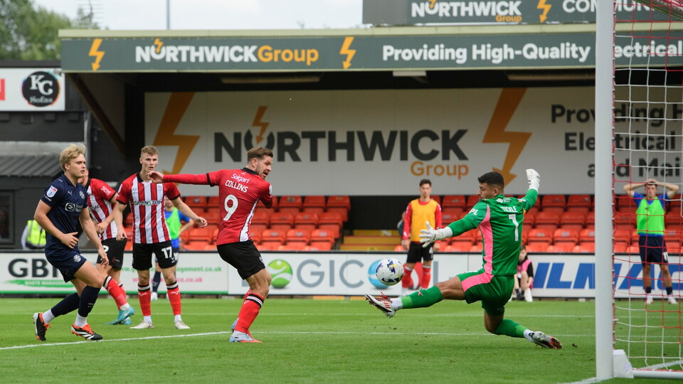 James Collins of Lincoln City scores his side's second goal during the EFL Sky Bet League One match between Lincoln City and Wigan Athletic at LNER Stadium, Lincoln.