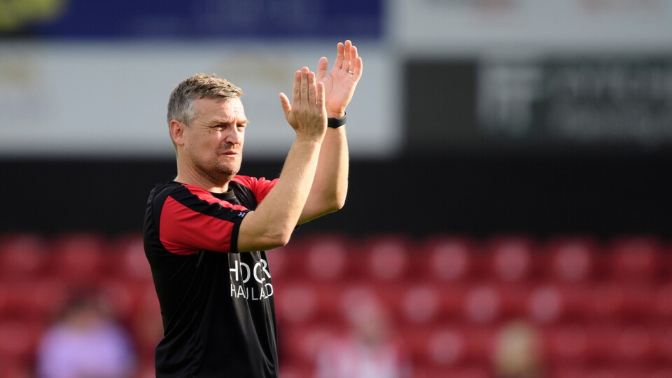 Michael Skubala, head coach of Lincoln City applauds the fans at the final whistle following the EFL Sky Bet League One match between Lincoln City and Wigan Athletic at LNER Stadium, Lincoln.