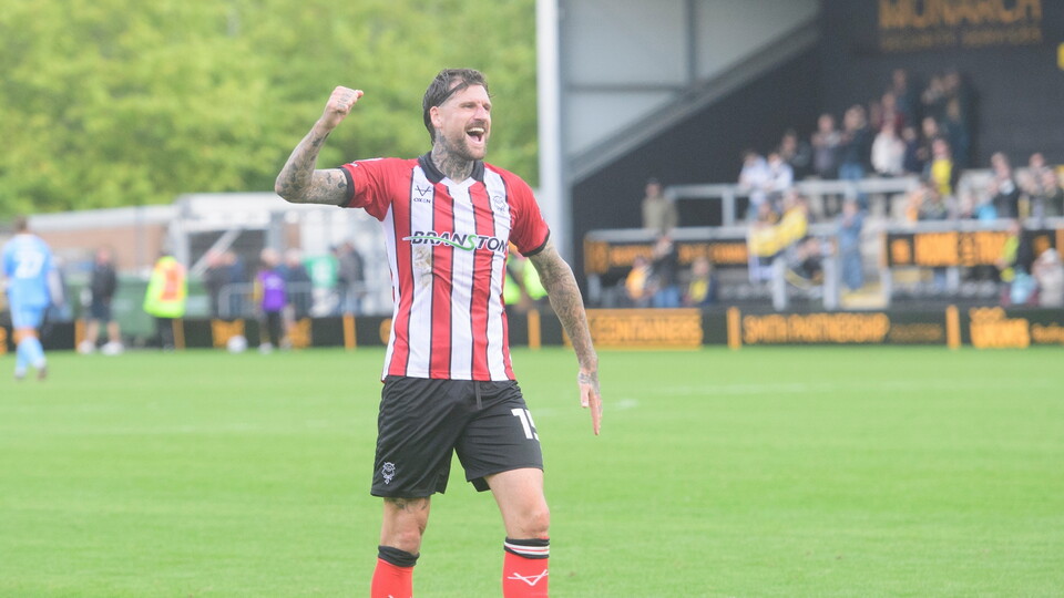 Sonny Bradley of Lincoln City applauds the fans at the final whistle following the EFL Sky Bet League One match between Burton Albion and Lincoln City at Pirelli Stadium, Burton-upon-Trent.