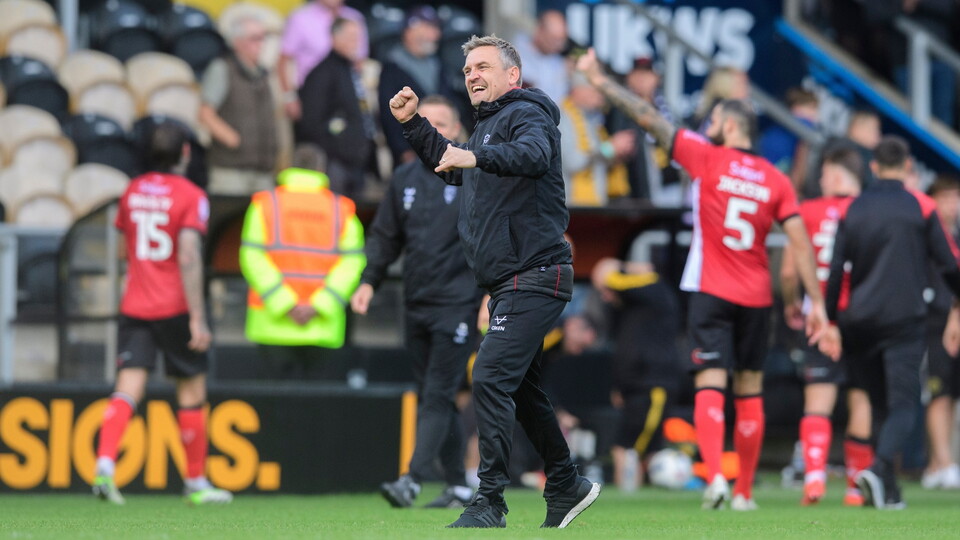 Michael Skubala, head coach of Lincoln City celebrates following the EFL Sky Bet League One match between Burton Albion and Lincoln City at Pirelli Stadium, Burton-upon-Trent.