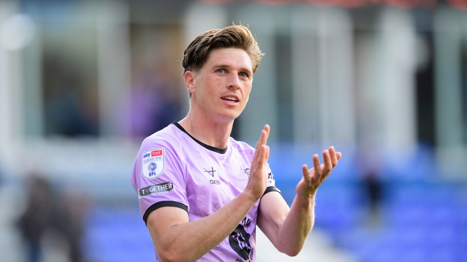 Adam Reach of Lincoln City applauds the fans at the final whistle following the EFL Sky Bet League One match between Peterborough United and Lincoln City at Weston Homes Stadium, Peterborough.