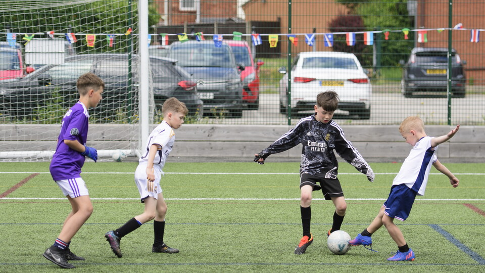 children playing football
