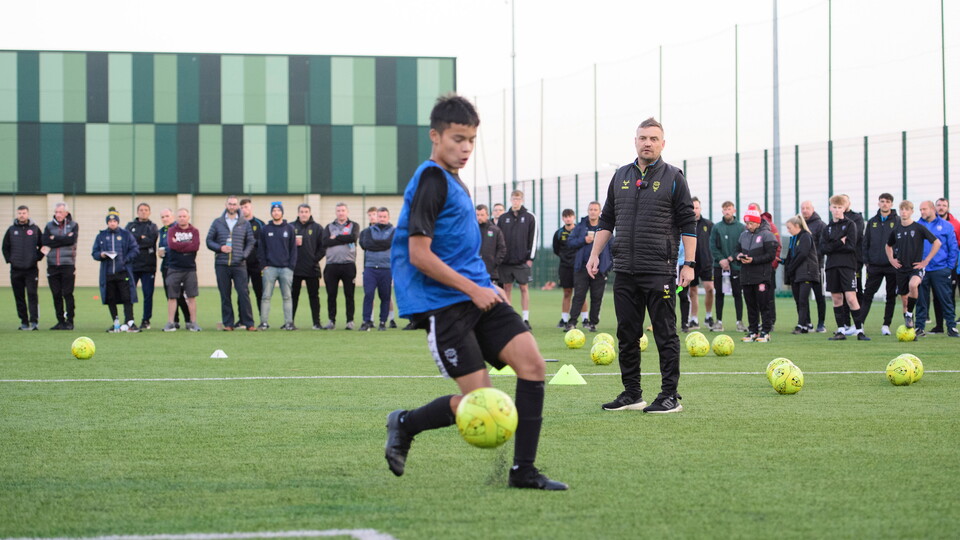 Lincoln City head coach Michael Skubala oversees a training session