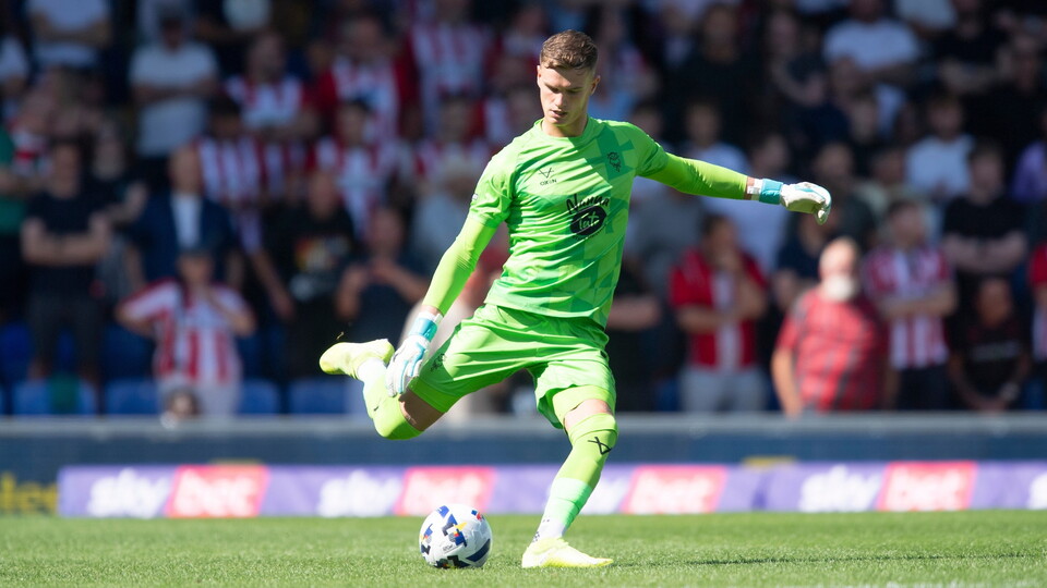 George Wickens of Lincoln City during the EFL Sky Bet League One match between AFC Wimbledon and Lincoln City at The Cherry Red Records Stadium, Wimbledon.