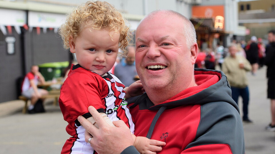 A young City fan and their guardian outside the LNER Stadium