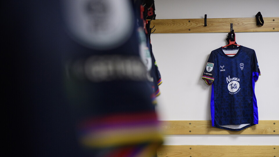 A blue shirt hung up in the changing room at Barnsley FC