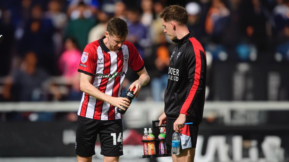 Conor McGrandles with a bottle of Carabao Sport drink.