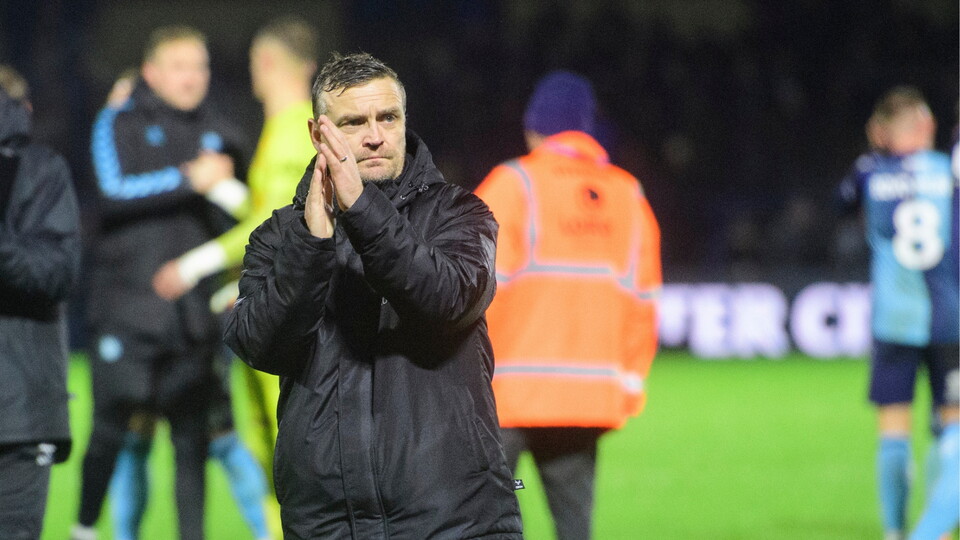 Michael Skubala, head coach of Lincoln City applauds the fans at the final whistle following the EFL Sky Bet League One match between Wycombe Wanderers and Lincoln City at Adams Park, High Wycombe.