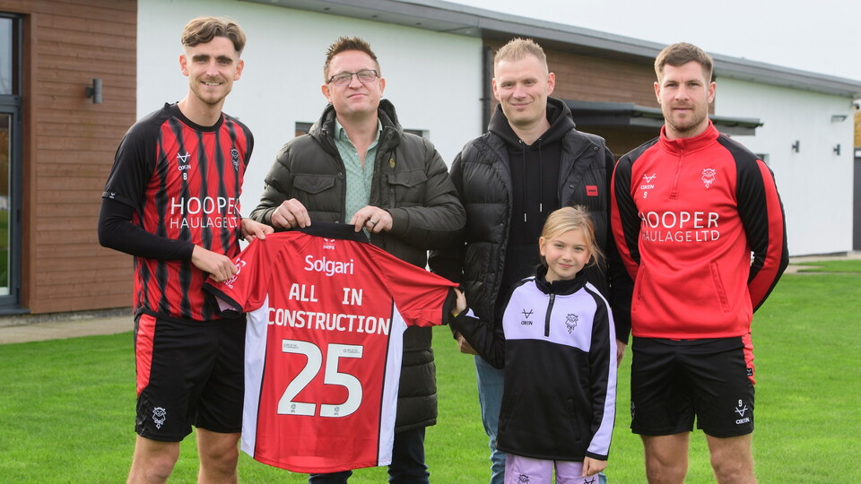 Lincoln City commercial partnership | Tom Bayliss of Lincoln City and James Collins of Lincoln City with All In Construction at the Elite Performance Centre, Scampton.