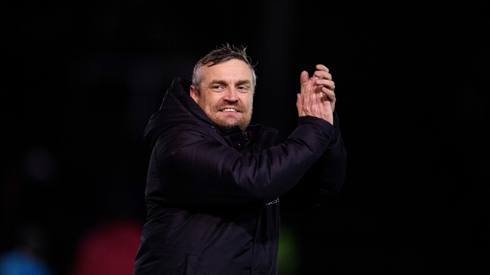 Michael Skubala, head coach of Lincoln City applauds the fans at the final whistle following the EFL Sky Bet League One match between Lincoln City and Port Vale at LNER Stadium, Lincoln.