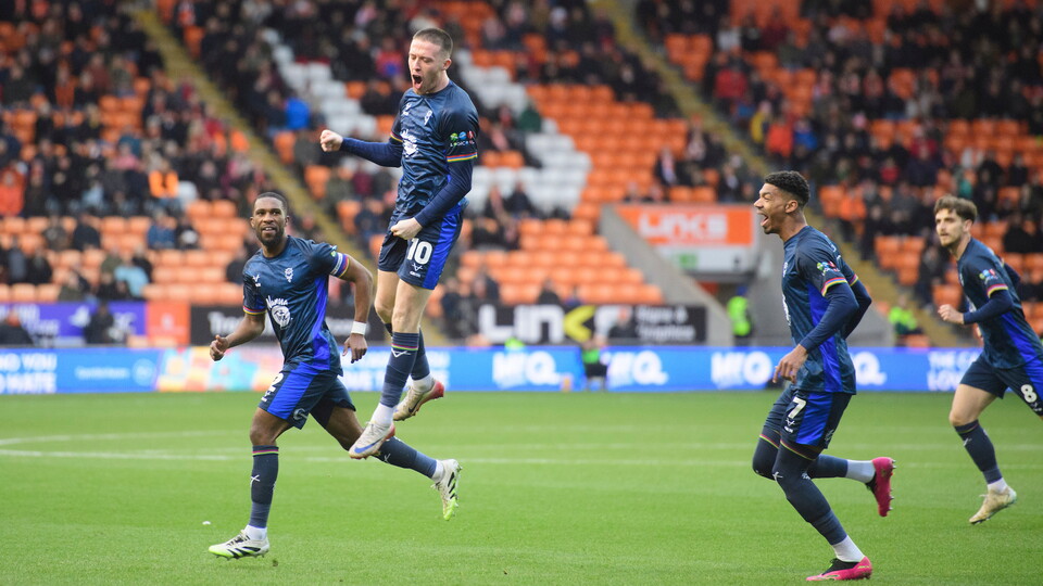 Jack Moylan of Lincoln City celebrates scoring the opening goal during the EFL Sky Bet League One match between Blackpool and Lincoln City at Bloomfield Road, Blackpool.
