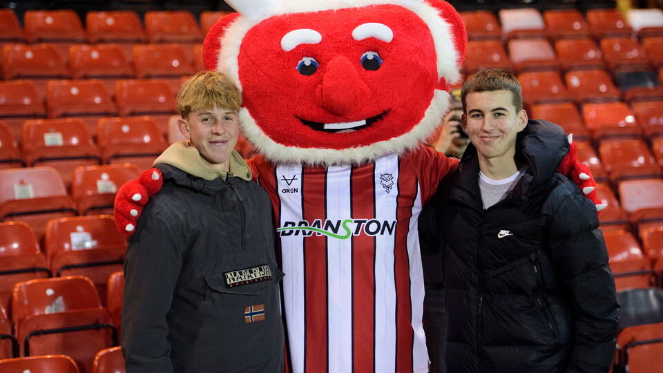 Lincoln City fans enjoy the pre-match atmosphere during the Vertu Trophy round of 32 northern section match between Lincoln City and Huddersfield Town at LNER Stadium, Lincoln.