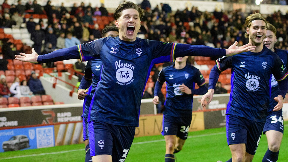 Adam Reach celebrates scoring for City at Barnsley