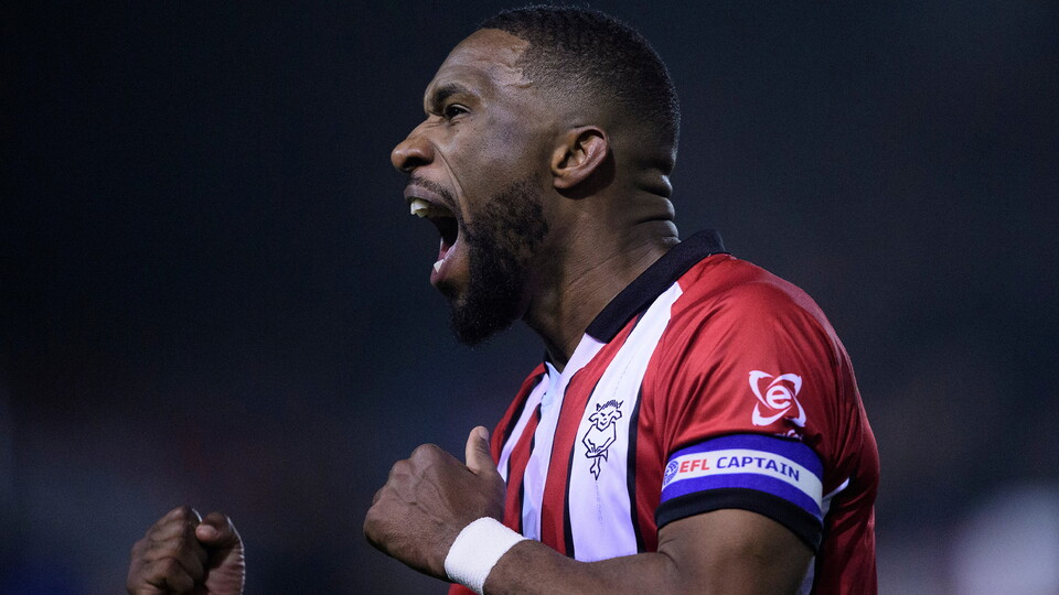Tendayi Darikwa celebrates the Imps' win over Cardiff City