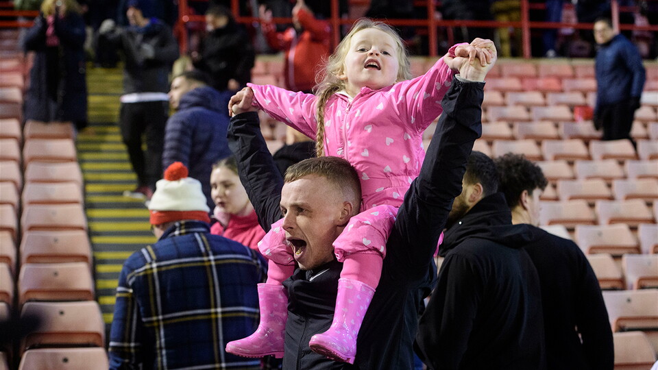 Fans celebrate Lincoln City's 2-0 win at Barnsley