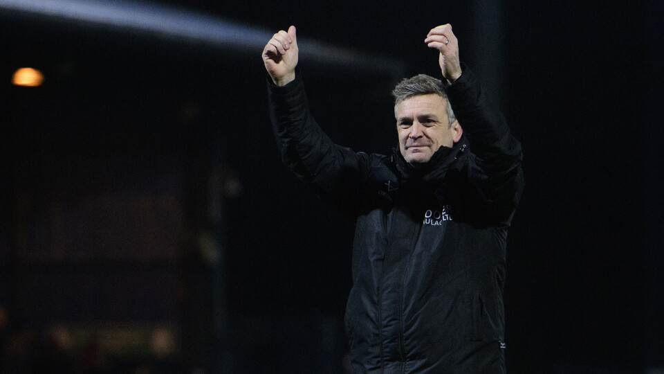 Michael Skubala holds both hands up giving thumbs up