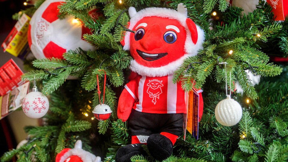 A Christmas tree featuring a Poacher the Imp toy