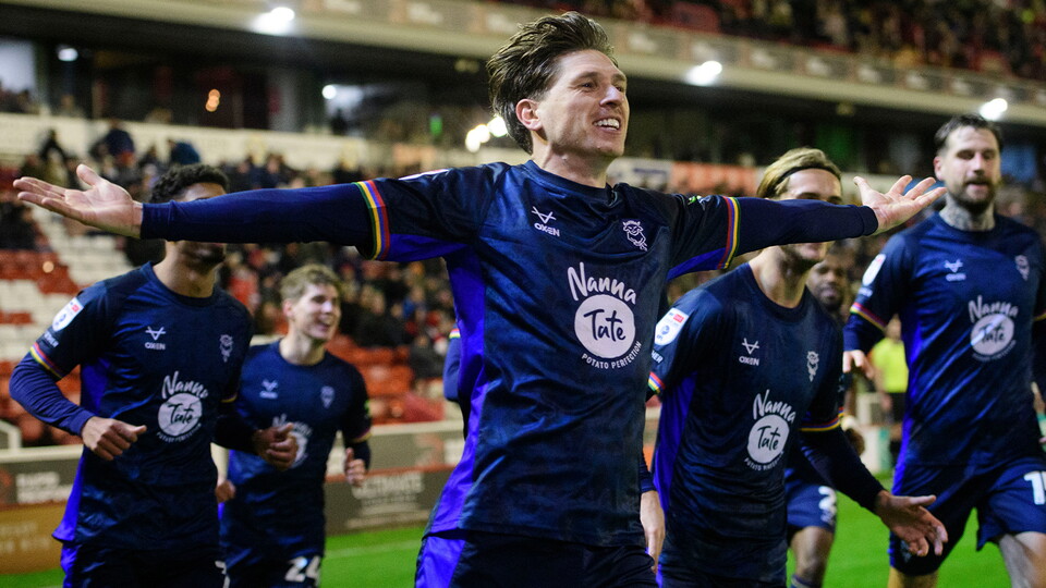 Adam Reach celebrates scoring at Barnsley