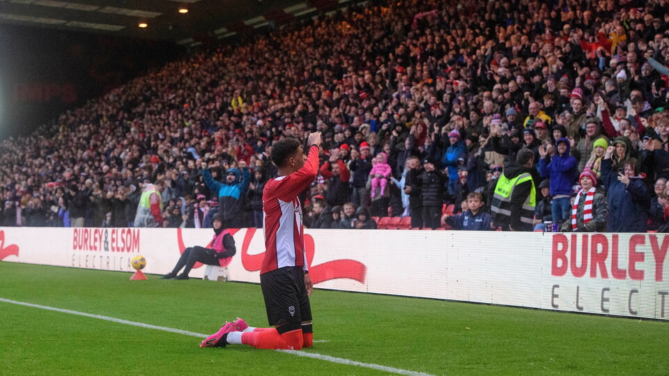 Reeco Hackett of Lincoln City celebrates scoring the opening goal during the EFL Sky Bet League One match between Lincoln City and Port Vale at LNER Stadium, Lincoln.