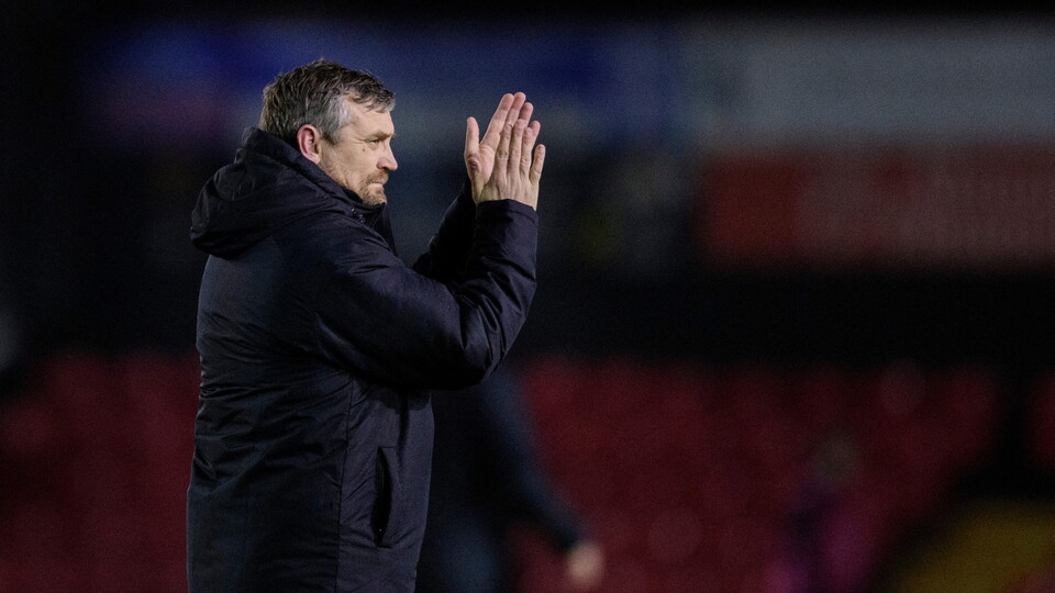 Michael Skubala, head coach of Lincoln City applauds the fans at the final whistle following the Vertu Trophy round of 32 northern section match between Lincoln City and Huddersfield Town at LNER Stadium, Lincoln.