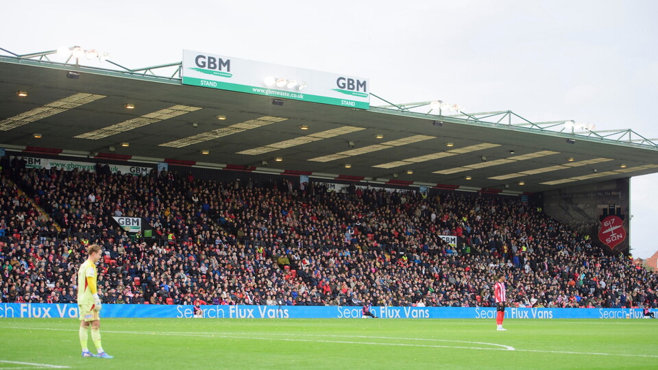 Lincoln City fans watch their team in action during the EFL Sky Bet League One match between Lincoln City and Exeter City at LNER Stadium, Lincoln.
