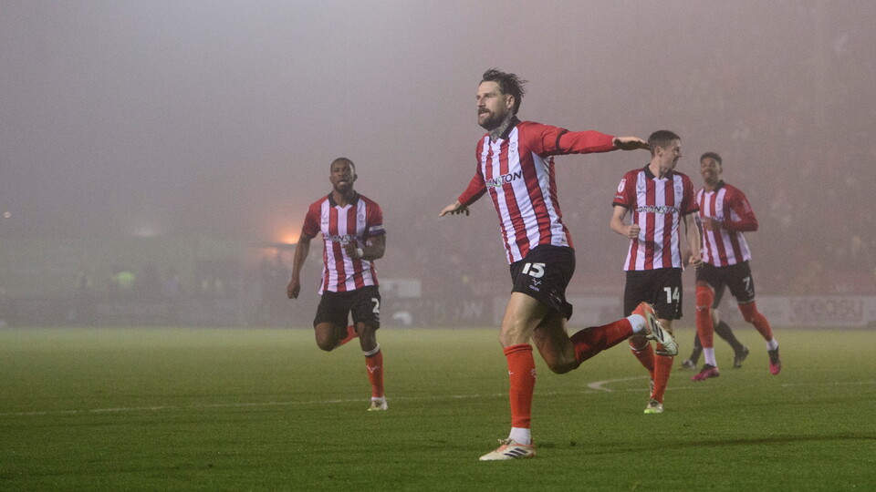 Sonny Bradley of Lincoln City celebrates scoring his side's second goal during the EFL Sky Bet League One match between Lincoln City and Cardiff City at LNER Stadium, Lincoln.