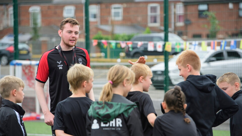 Marshall Dixon, academy player care manager of Lincoln City during a Lincoln City Academy and Lincoln City Foundation Masterclass on the 3G astroturf prior to the pre-season friendly match between Lincoln City and West Bromwich Albion at LNER Stadium, Lincoln.