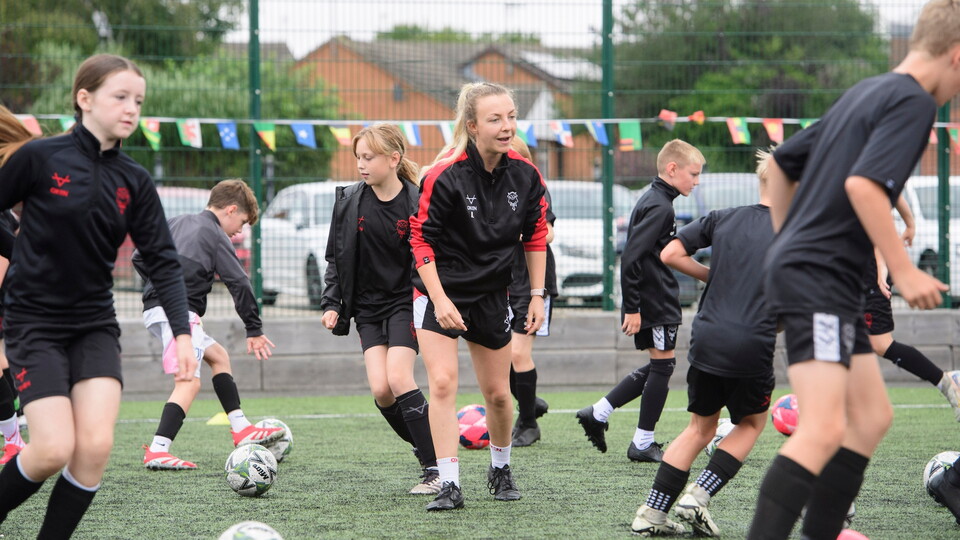 Iona Lawson, assistant foundation phase lead coach of Lincoln City during a Lincoln City Academy and Lincoln City Foundation Masterclass on the 3G astroturf prior to the pre-season friendly match between Lincoln City and West Bromwich Albion at LNER Stadium, Lincoln.
