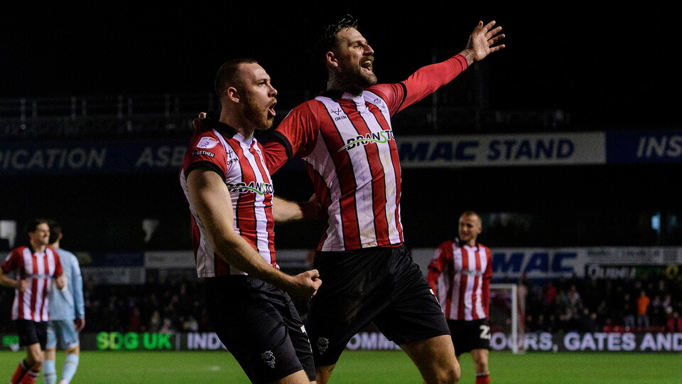 City celebrate scoring against Bradford City