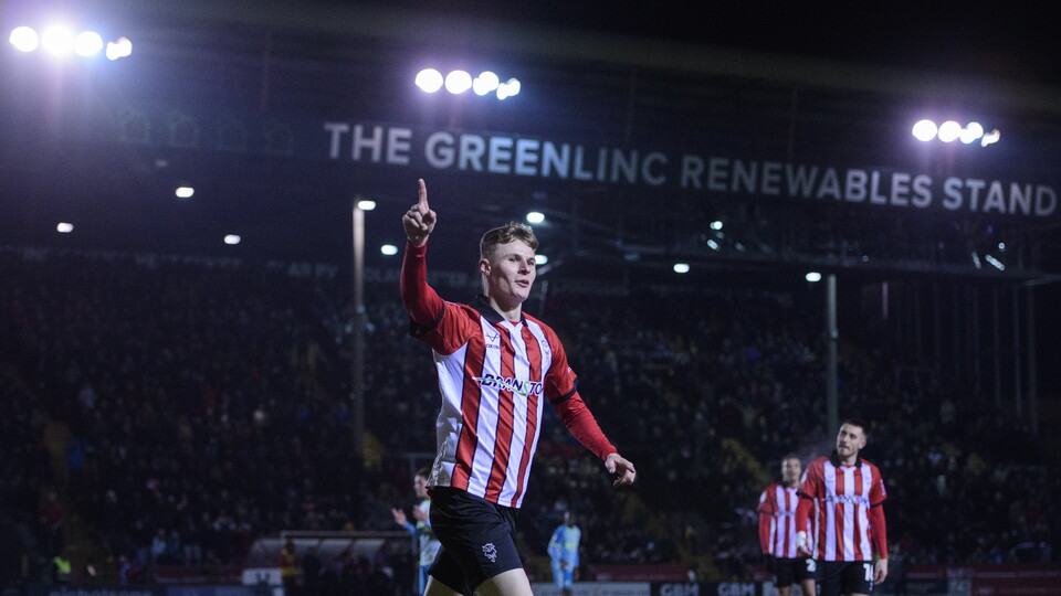 Rob Street celebrates a goal by running with his right hand up