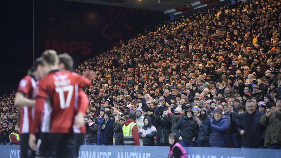 Lincoln City fans celebrate a goal