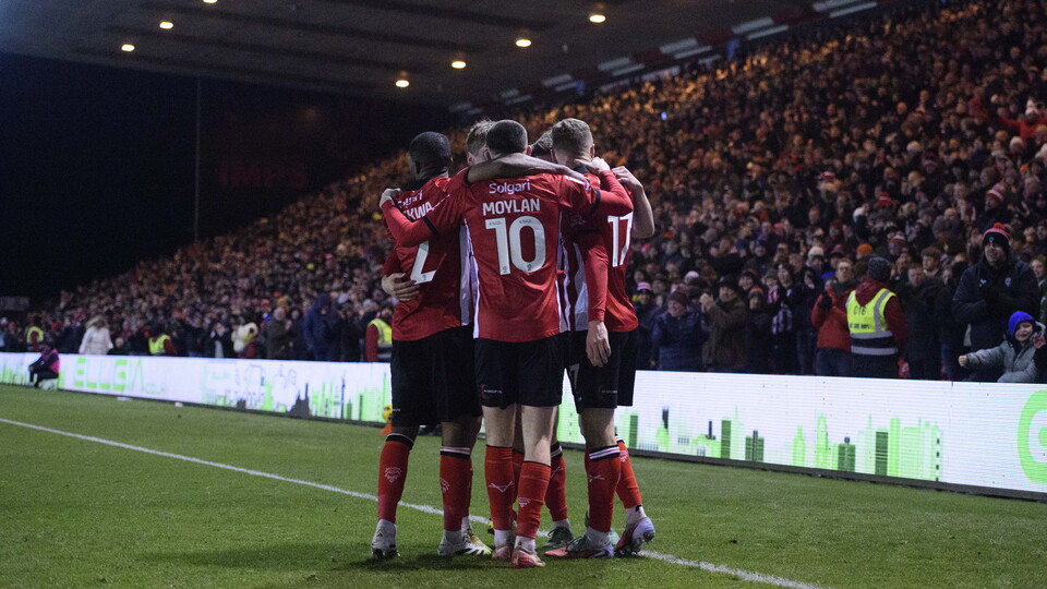 Players celebrate a goal