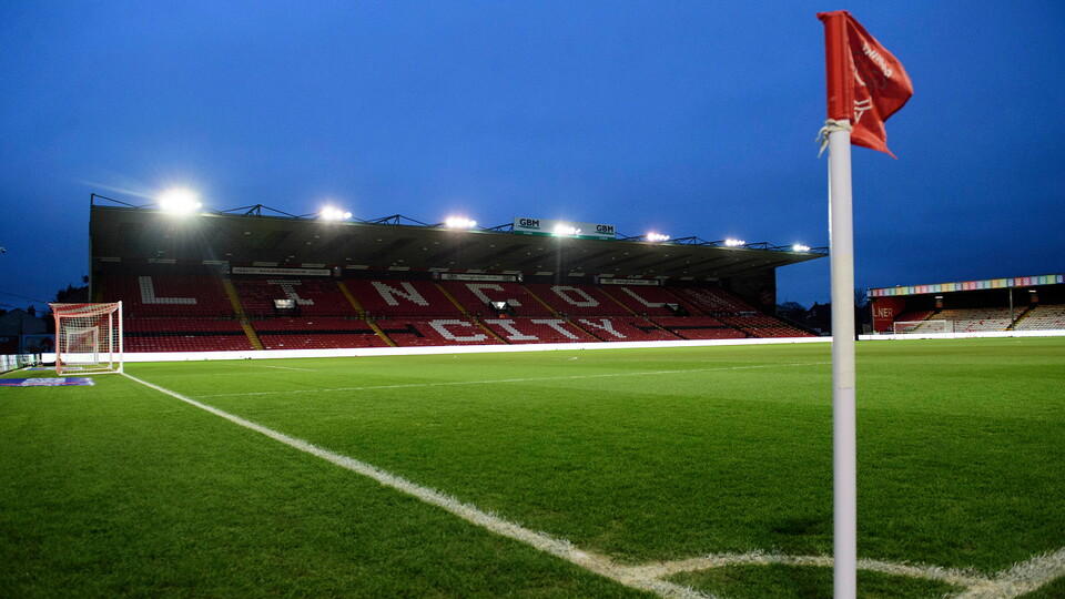 A nighttime image of Lincoln City's LNER Stadium
